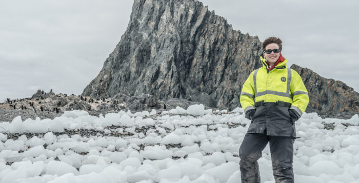 Heather Lynch stands in snow in the antarctic