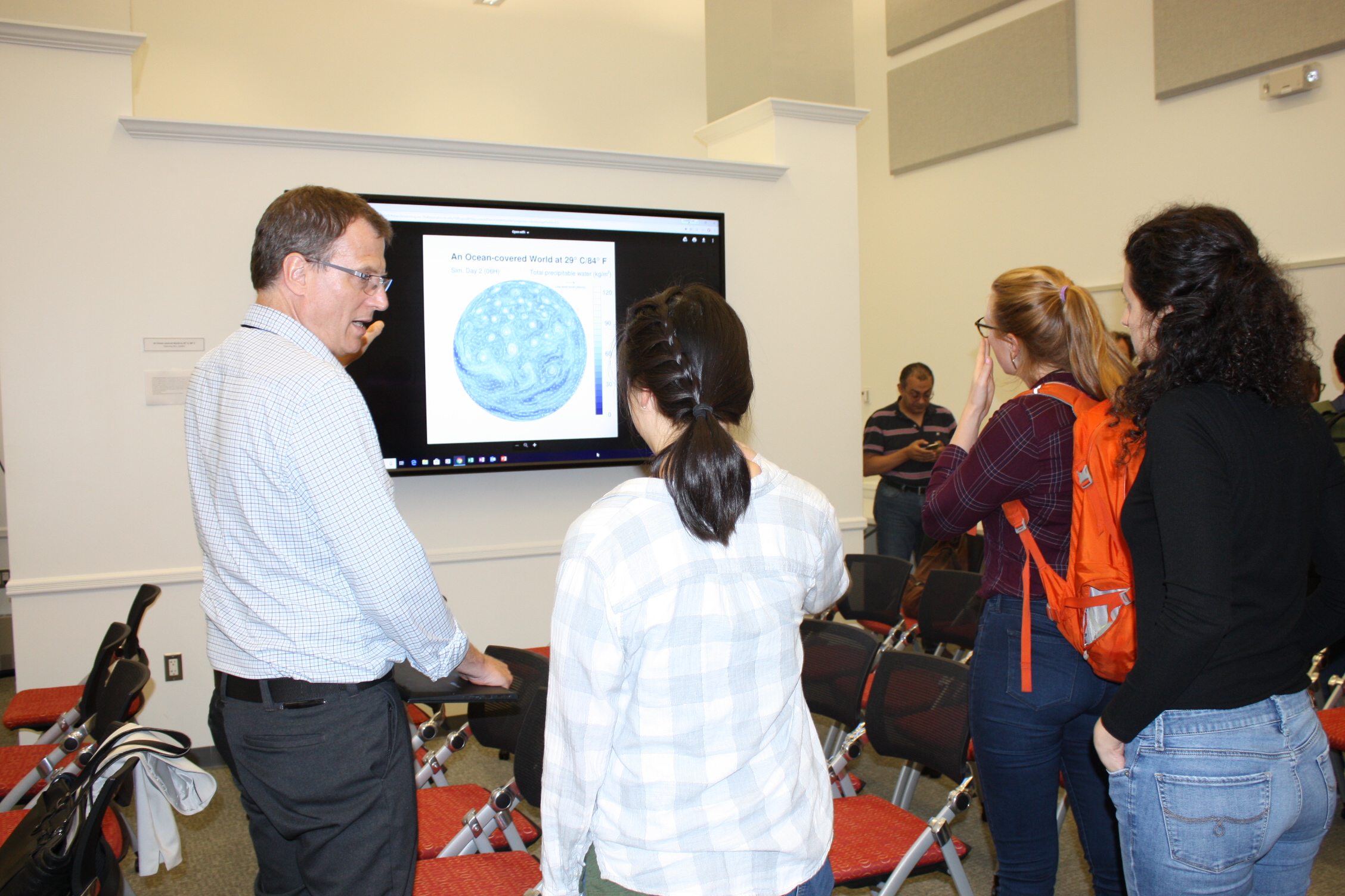 Robert Harrison looks at a visualization entry with students