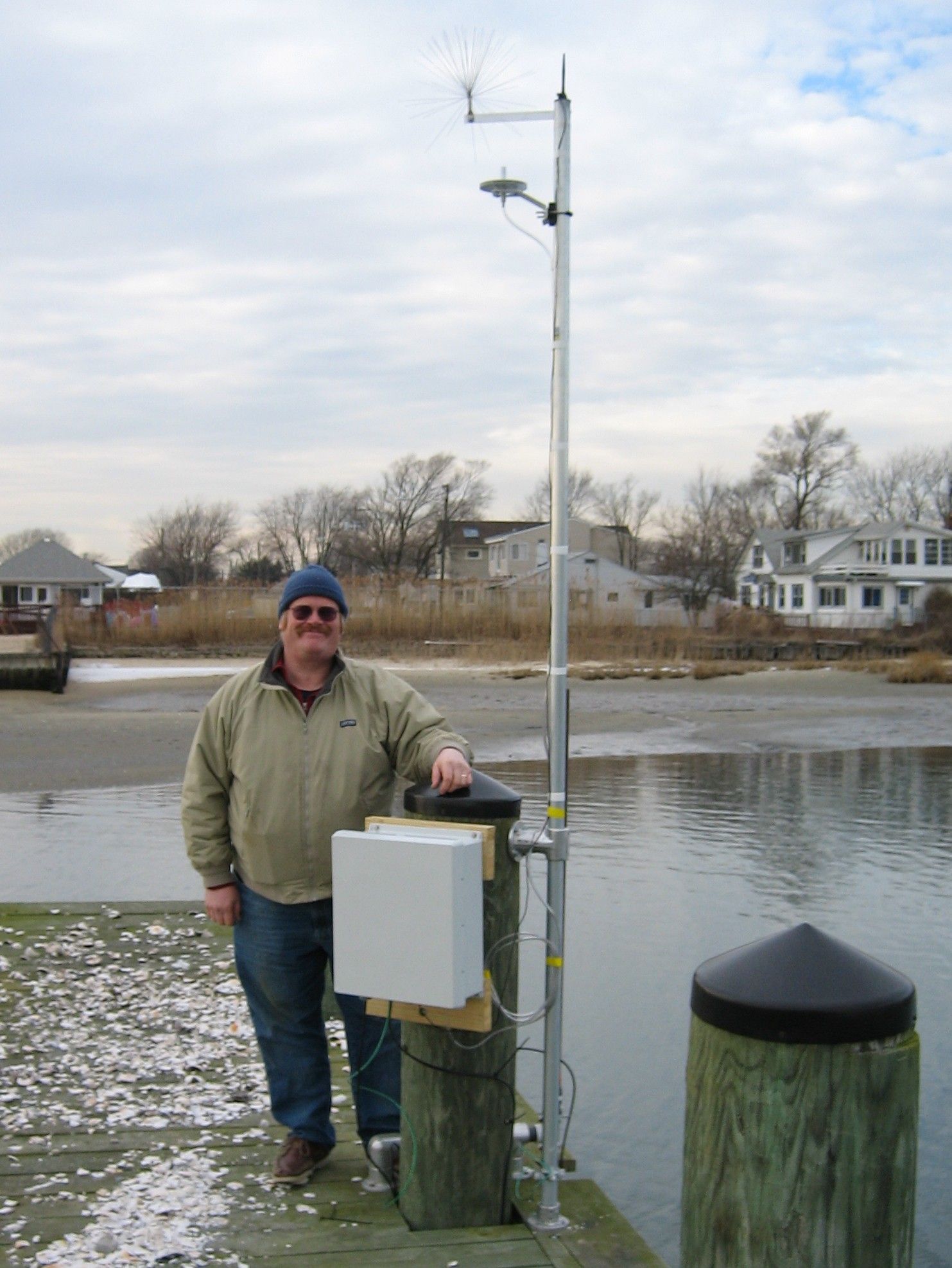 Tom Wilson stands next to the LI Shore Bay Park station