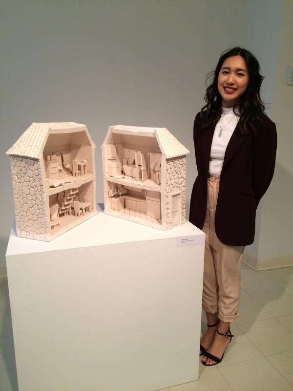 Stefanie Chen with her ceramic sculpture Home Sweet Home